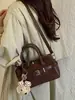 Bolso de mano casual de moda nuevo para principios de otoño de 2026, Boston de alta estética para el trabajo, bolso de hombro y cruzado