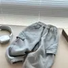 Pantalones de chándal de trabajo nuevos para niños estilo coreano primavera y otoño 2026, pantalones deportivos de corte holgado, pantalones casuales versátiles para uso en exteriores