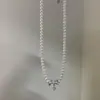 2026 Nuevo Modelo Oso Dibujo Animado Collar Tejido Colgante de Circonita Plateada Collar de Perlas Diseño de Nicho Lujo Ligero Gama Alta