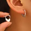 Pendientes de estilo europeo y americano, sencillos y huecos, con forma de corazón de metal, con hebilla para la oreja, de Joker, para una generación de cabello.