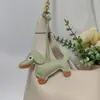 Colgante de Perro Salchicha Nuevo Transfronterizo Dibujos Animados Colgante de Bolsa de Cachorro de Cuero Accesorios para Funda de Teléfono Móvil Accesorios Creativos para Coche