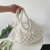 Bolso tejido para mujer para pedidos extranjeros, nuevo bolso de hombro calado de verano 2026, bolso cruzado de gran capacidad para vacaciones en la playa