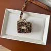 Pingente de Bolsa Pequena de Couro Artesanal Transfronteiriço, Carteira Premium, Pingente de PU Premium, Chaveiro, Bolsa, Bolsa Decorativa para Fones de Ouvido