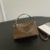 Bolso de mano único y discreto de lujo para mujer, nuevo modelo 2026, lindo y versátil, bolso de hombro y cruzado vintage de otoño para el trabajo