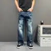 Jeans Raw Denim Estilo Retrô para Homens 2026 Calças de Perna Larga Perna Reta Estilo Coreano Simples Versátil Senso de Design Calças Longas Bordadas