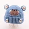 Bonitos y adorables gorros de otoño e invierno para niños, con diseño de poner, material de punto y una serie de dibujos animados, que brindan abrigo y protección para los oídos para bebés y niños pequeños.