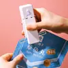 Mini Selladora Portátil Recargable Pequeña para Empaque Doméstico Clip Sellador de Bolsa de Snacks Presionado a Mano