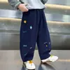 Pantalones curvos de primavera y otoño para niños, pantalones largos casuales holgados para niños, pantalones de pierna ancha con estampado de dibujos animados para bebé, pantalones elegantes y modernos