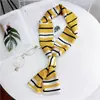Bufanda larga nueva bufanda pequeña para mujer de Corea del Sur primavera y otoño bufanda fina estrecha de doble cara corbata de moda decorativa