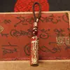 Llavero de tarro con mantra Lingyagn de aceite rojo, tarro hueco de latón puro con sutra, se puede abrir para guardar sutras, colgante de cuerda trenzada hecho a mano
