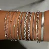 Conjunto de pulsera de cadena de oro de múltiples capas de hoja cruzada minimalista europeo y americano, moderno y elegante, pulsera retorcida en forma de corazón multicapa de lujo ligero