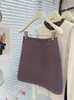 Nova Saia Mini Retrô Outono/Inverno 2026 Petite de Lã Misturada Justa na Cintura Linha A para Mulheres Cintura Alta Anti-Exposição