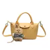 Versátil bolso de hombro tejido nuevo para ir al trabajo, elegante bolso tipo cubo, bolso cruzado para mujer simple y versátil