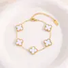 Elegante Pulseira Clássica de Trevo de Quatro Folhas Luxo Leve Toque de Alto Padrão Feminina Dupla Face Concha Aço Titânio Dourado 18K Pulseira Vendedor de Sucesso Transfronteiriço