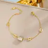 Pulsera de acero de titanio de cuerpo entero de venta caliente transfronteriza para mujer, temperamento de lujo ligero, coreana, galvanoplastia de oro real de 18K, venta al por mayor de joyería