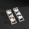 Pendientes de botón con borla de corazón y rectángulo incrustado de diamantes de imitación, estilo nuevo europeo y americano, con pasador de plata, para mujer, diseño de lujo ligero, sentido de gama alta, sentido de diseño, nicho