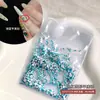 Venta al por mayor de Materiales de Uñas Trendy Estilo Chino Huanhuan, Pedrería de Punta Color Esmeralda Famosa en Internet, Pedrería Redonda de Fondo Plano y Accesorios de Uñas de Perlas