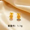 Aretes de flor dorados al por mayor lujo ligero sensación de alta gama aretes largos de borla de perla dorada para mujer alta retención de color joyería para orejas de Año Nuevo