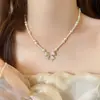 Nuevo Collar de Perlas Retro Francés para Otoño e Invierno Cadena para Clavícula con Lazo de Circonita de Gama Alta para Mujer Collar Popular Exquisito
