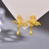 Pendientes de mariposa de seda hueca de oro de imitación, método antiguo, pendientes colgantes de temperamento de oro arena, pendientes femeninos de una generación de cabello