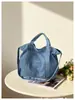 Bolso de mezclilla grande personalizado estilo retro para mujer, nueva colección otoño/invierno 2026, bolso cruzado o de hombro moderno y casual
