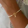 2025 Moda Nueva Transfronteriza Pulsera de Letras Inglesas Cobre Incrustado Circonita Oval Perla de Imitación Pulsera de Perlas al por Mayor