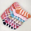 Venta al por mayor de fábrica calcetines de suelo a rayas de forro polar coral para otoño e invierno, calcetines de toalla cálidos de media felpa para niños 811