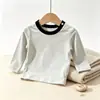 Camiseta cómoda de manga larga 100% algodón con botones en el hombro, ropa nueva de primavera para niños pequeños y bebés, top de nicho para primavera/otoño