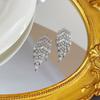Aretes retro exquisitos estilo frío con borla de circonita, elegantes, de lujo ligero, de alta gama, personalidad, moda versátil, aretes de botón