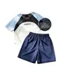 Comercio Exterior Venta Caliente Bloque de Color Conjunto de Camiseta de Manga Corta y Pantalones Cortos de Secado Rápido para Niños Malla Transpirable Raglán Manga Corta Unisex Deportivo Transpirable