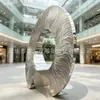 Escultura circular de acero inoxidable con patrón de agua, adorno de arte metálico con acabado espejo para centros comerciales, vestíbulos de hoteles y oficinas de ventas, forma abstracta de anillo