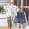 Conjunto de Manga Corta de Dibujos Animados Estilo Coreano para Niños Nuevo Conjunto de Dos Piezas con Top de Manga Corta Estampado Completo Combinado con Shorts de Mezclilla Suave Ropa Infantil