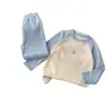 Ropa interior térmica para niños y niñas, tops y pantalones de otoño, empalme de color liso, ropa de casa sencilla, nuevo conjunto de cuello redondo 2025