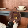 Bolso de mano de diseño minimalista de nicho transfronterizo, bolso cuadrado pequeño moderno para mujer, bolso cruzado Kelly para el día a día