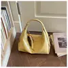 Bolsa de Mão Simples Casual Estilo Coreano Transfronteiriça Bolsa Dumpling Feminina 2026 Nova Pequena Nicho Moda Versátil Ombro Transversal