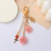 Chaveiro de Borla de Flor de Camélia de Resina Estilo Ins Pingente de Flor de Folha Menina Fone de Ouvido Bolsa Pingente Decorativo