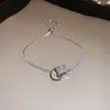 [Cadena de Diamantes Arcoíris] Pulsera de extracción de zircón trenzado en cruz, una pulsera lujosa y de alta gama, una pieza de joyería delicada y de moda