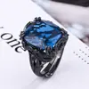Anel Europeu e Americano Transfronteiriço Feminino Cobre Dourado Banhado Cor de Simulação Pedra Preciosa Corindo Ouro Negro Anel de Personalidade Feminino 14*16