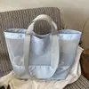 La nueva bolsa de almacenamiento de viaje de un solo hombro de Ruien es un bolso de malla de gran capacidad, moderno y de moda para ir al trabajo y la playa.