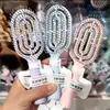 Mini peine de costillas portátil con diseño hueco para volumen alto en la coronilla, cojín de masaje, adecuado para estudiantes, hombres y mujeres, peine pequeño portátil