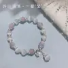 Pulsera de cuentas de piedra ojo de gato nueva pulsera de estrellas y mariposa femenina nicho alta gama pulsera de cristal aguamarina al por mayor