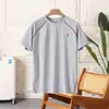 ¡Artículo Caliente de Dachang! Camiseta Deportiva Unisex para Pareja Estilo Patchwork Bloques de Color Estampado de Letras Manga Corta Cuello Redondo