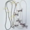Comercio exterior venta caliente cadena de mariposa de cadena de perla de imitación ABS cadena universal para teléfono móvil llavero cordón de lazo anti-pérdida