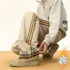 Pantalones Casuales de Raya Lateral Estilo Americano Otoño e Invierno 2025 Nuevos de Moda Gruesos Cálidos de Algodón Rectos Sueltos Largos