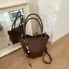Bolsa tote tipo cubo elegante de gran capacidad transfronteriza, nueva colección otoño 2026, bolso de hombro/bolso cruzado casual y versátil, juego de dos bolsas