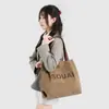 Bolsa de Lona con Letras Estilo Coreano 2026 Nueva Bolsa Grande de Gran Capacidad para Viajes Diarios Bolso de Hombro Casual Bolsa para Estudiante Universitario