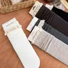 Calcetines de punto de color liso con ribete de encaje hasta la mitad de la pantorrilla estilo Dongdaemun coreano para mujer, estilo japonés de otoño e invierno, calcetines holgados rojos de Ankora dulces y retro