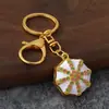 Llavero de estilo étnico con patrón octagonal, goteo de aceite e incrustaciones de diamantes, colgante de patrón vintage, regalo de recuerdo de viaje al por mayor