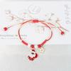 Directo de fábrica Pulsera tejida navideña transfronteriza europea y americana directa de fábrica Pulsera de Papá Noel Libro rojo pequeño Venta caliente