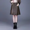Falda de cuero PU de color liso, minimalista, línea A para mujer, nueva colección otoño 2026, falda corta elástica de cintura alta, falda de paraguas elegante y versátil